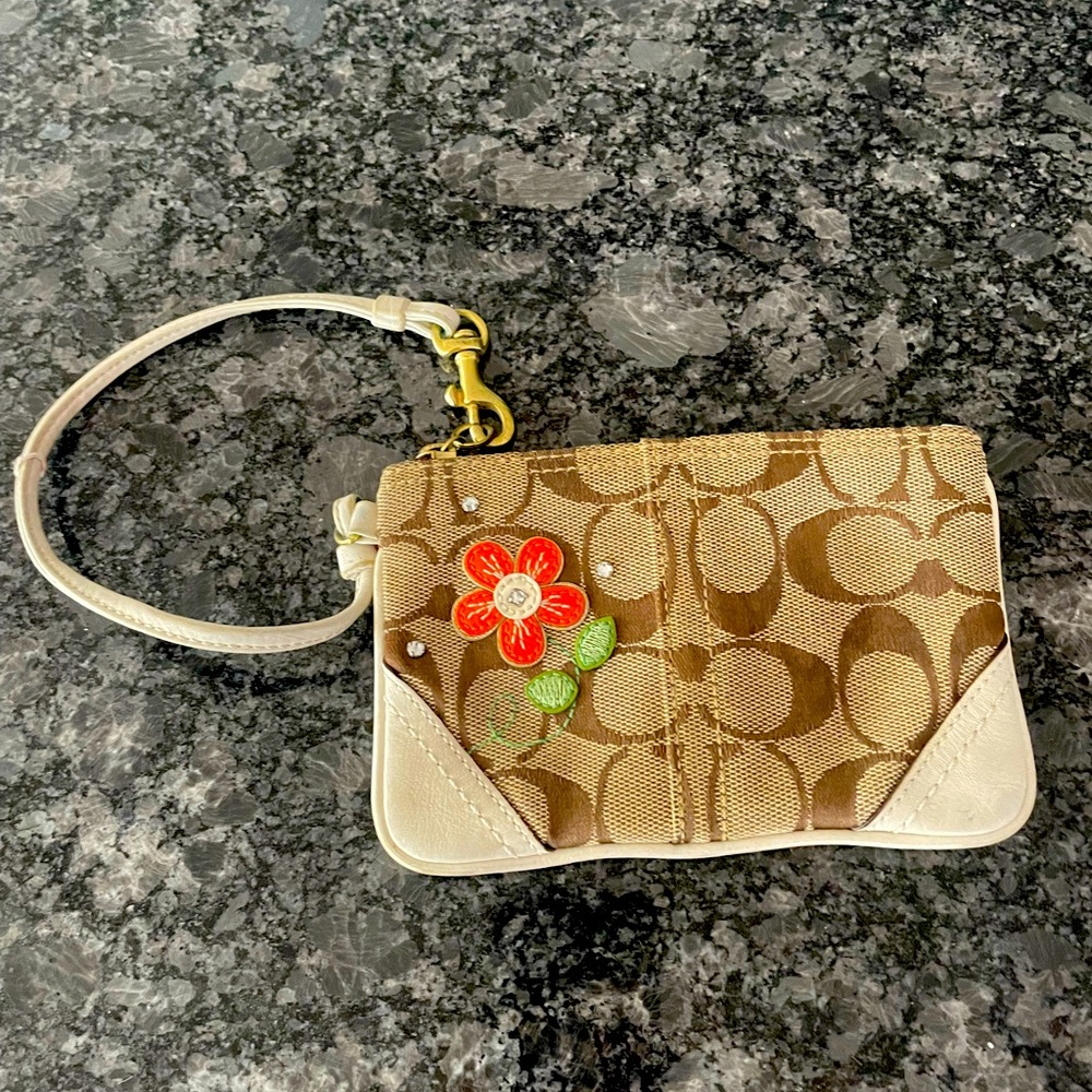 Cute, small Coach Wristlet with a Flower Accent